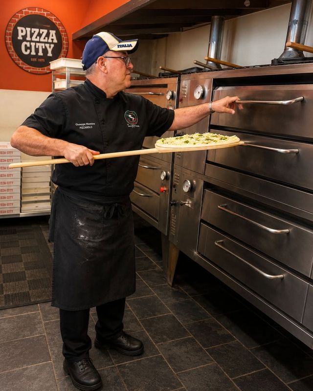 Giuseppe Mannino at the pizza oven