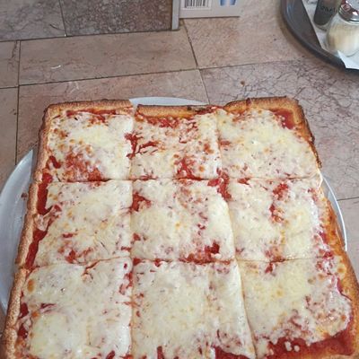 Square Sicilian cheese pizza cut into squares
